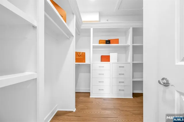 a view of an entryway with wooden floor