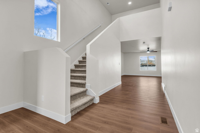 578 West 7th Midvale, UT 84047 - Photo 2 of 35 Stairway with a high ceiling and wood finished floors