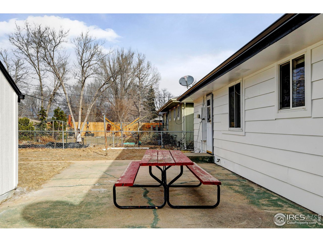 413 Riddle Drive Fort Collins, CO 80521 - Photo 27 of 33 Large fenced rear yard with a large patio.