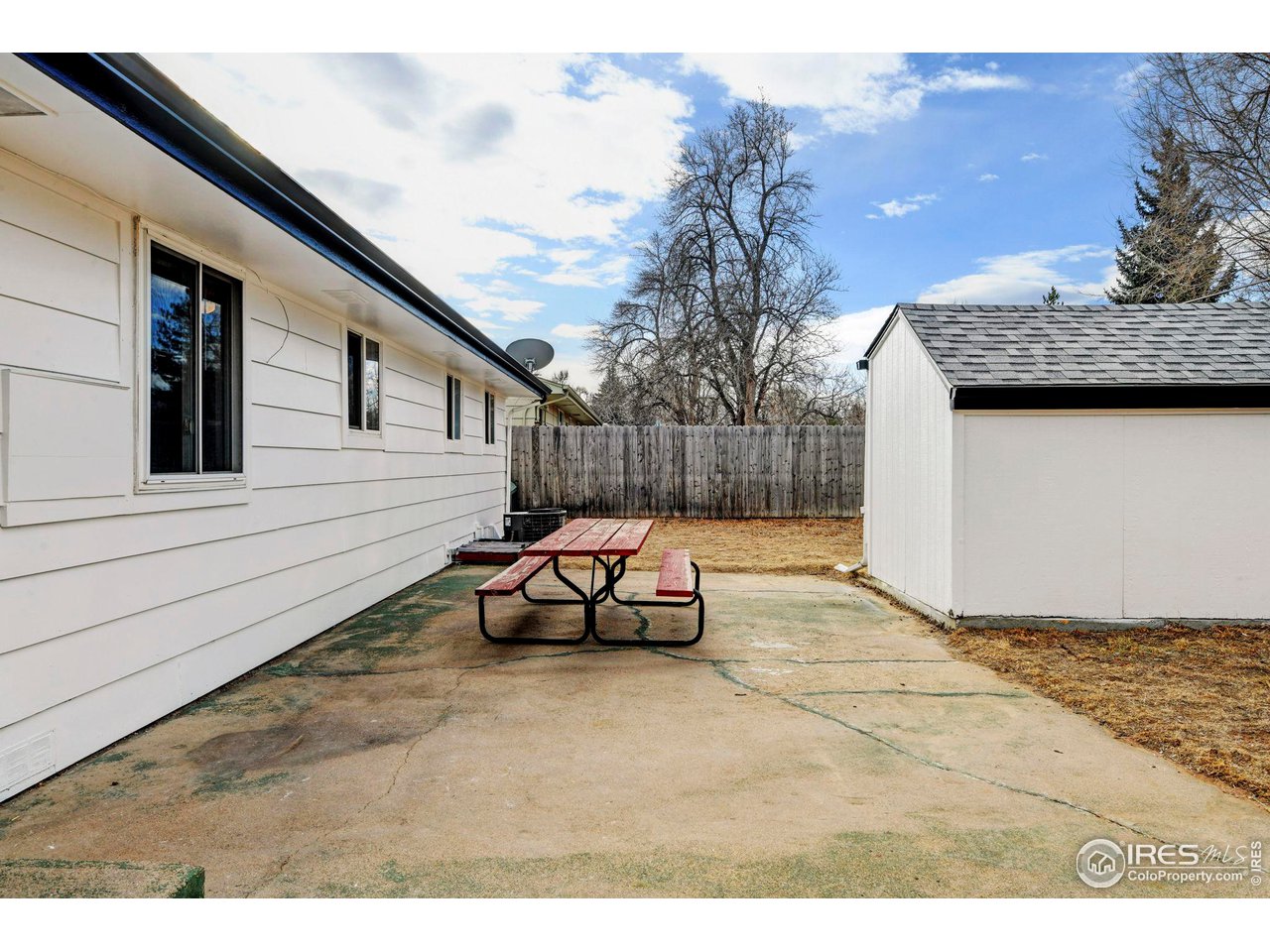 413 Riddle Drive Fort Collins, CO 80521 - Photo 29 of 33 Rear of home- with large storage shed.