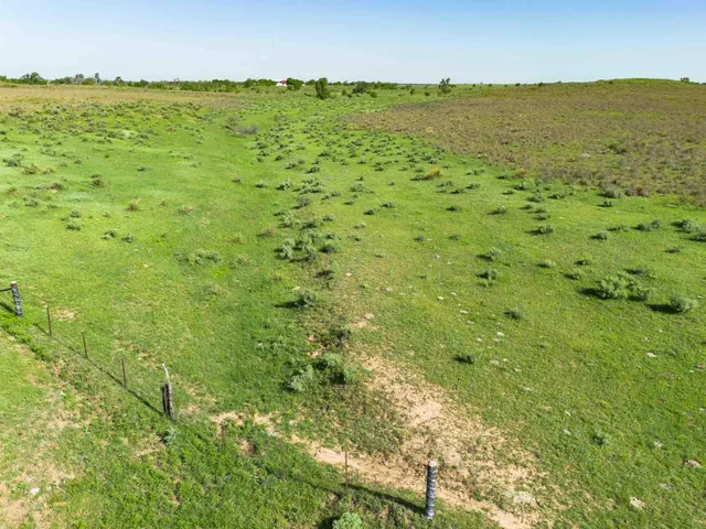 a view of room with window and wooden floor