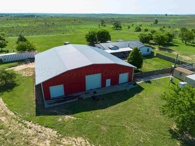a bathroom with a toilet and a floor to ceiling window