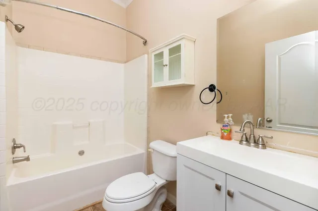 a view of a kitchen with wooden floor and a ceiling fan