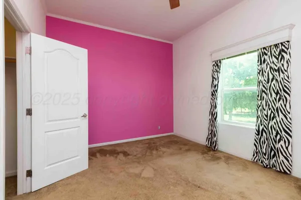 a view of a kitchen with wooden floor and a kitchen space with a sink