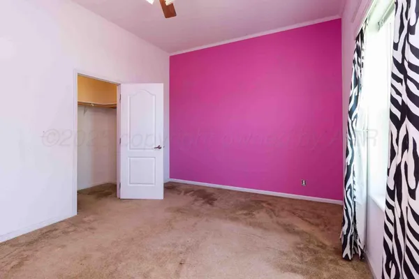 a kitchen with stainless steel appliances granite countertop a sink and dishwasher with white cabinets