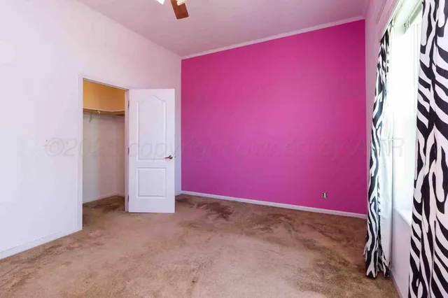 a kitchen with stainless steel appliances granite countertop a sink and dishwasher with white cabinets