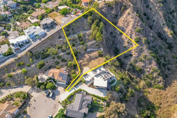 an aerial view of a house with a garden
