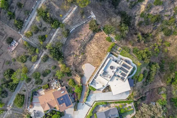 a view of a garden with a building