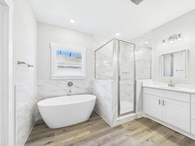 a bathroom with a bathtub and a sink