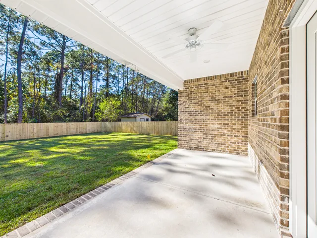 a view of house with backyard