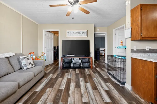 a living room with furniture and a flat screen tv