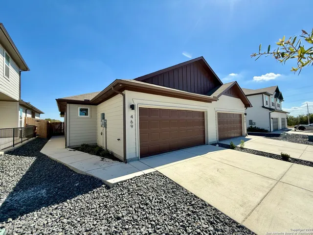 a front view of a house with a garage