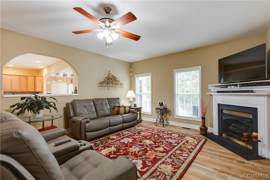 5924 Springmount Road Chesterfield, VA 23832 - Photo 11 of 49 a living room with furniture a fireplace and a flat screen tv