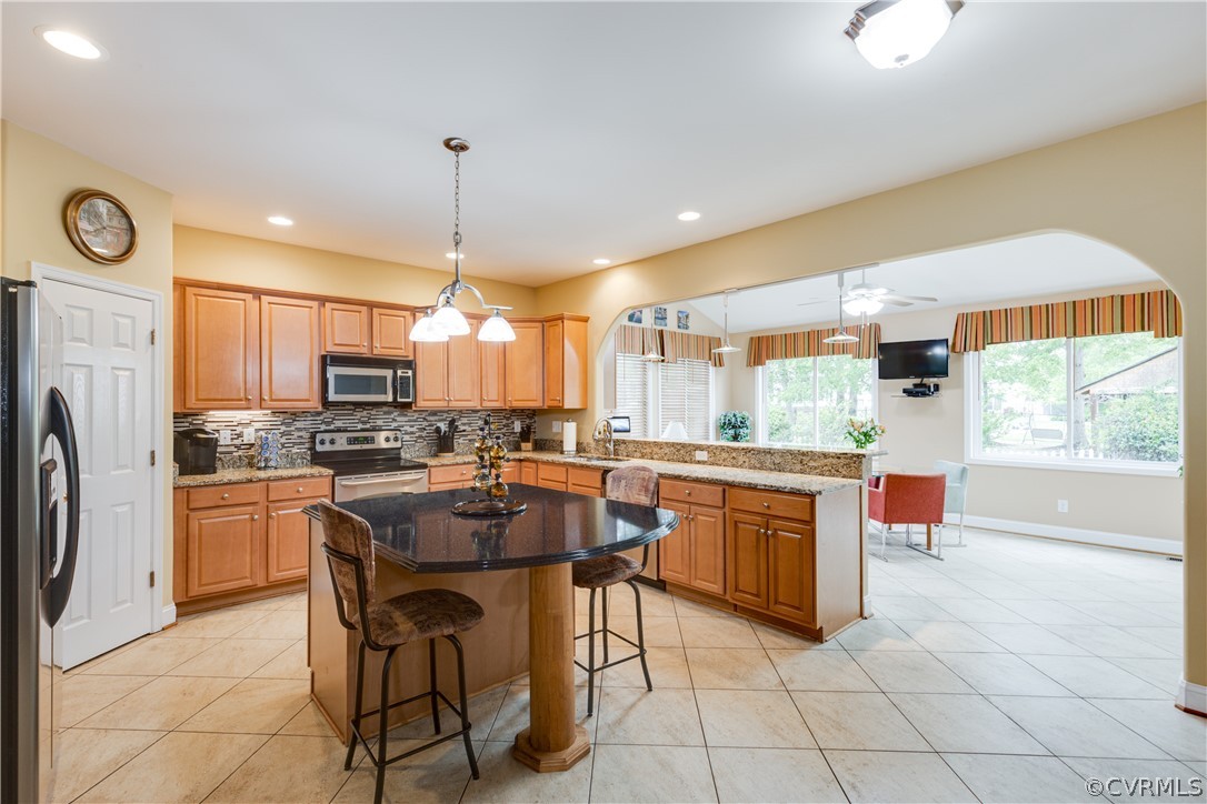 5924 Springmount Road Chesterfield, VA 23832 - Photo 16 of 49 a kitchen with stainless steel appliances granite countertop a stove top oven a sink dishwasher and a refrigerator