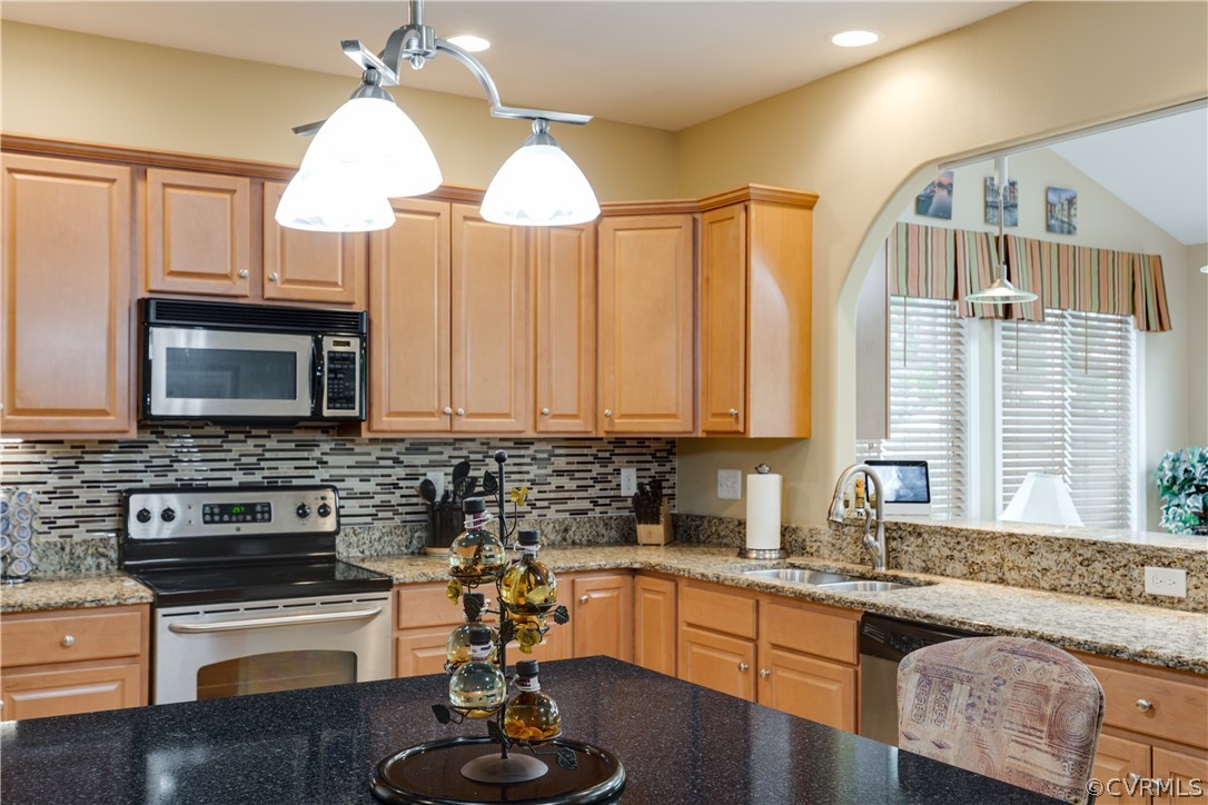 5924 Springmount Road Chesterfield, VA 23832 - Photo 18 of 49 a kitchen with stainless steel appliances granite countertop a stove a sink and a microwave