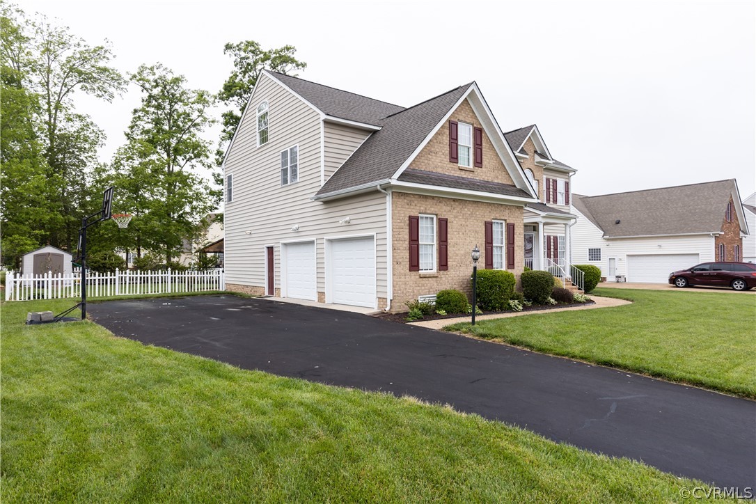 5924 Springmount Road Chesterfield, VA 23832 - Photo 2 of 49 a front view of a house with a yard and garage