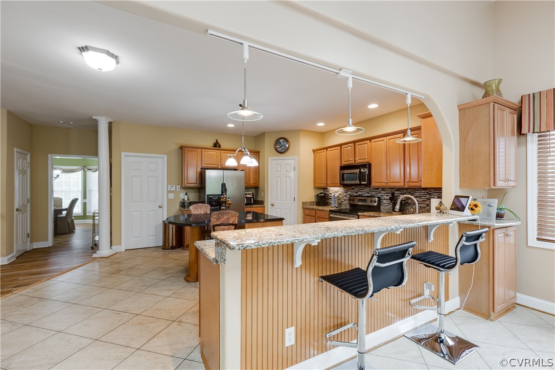 5924 Springmount Road Chesterfield, VA 23832 - Photo 21 of 49 a kitchen with a table chairs refrigerator and microwave