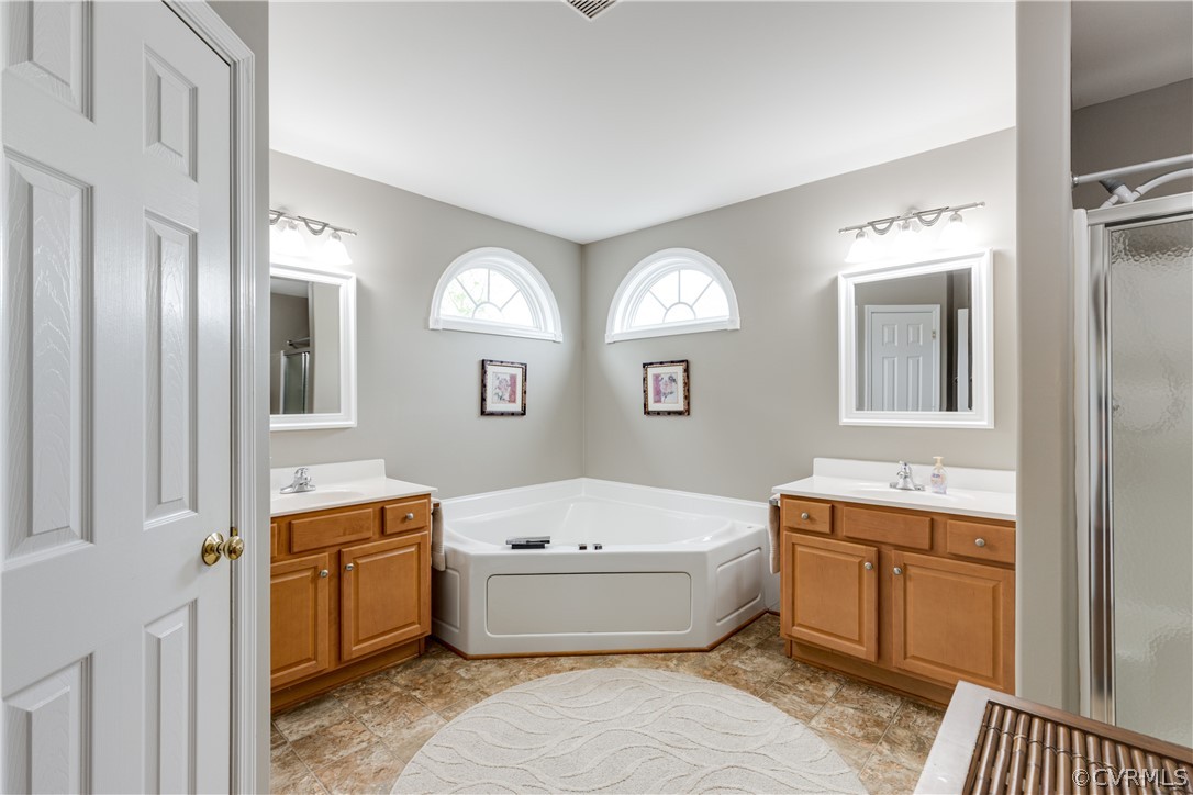 5924 Springmount Road Chesterfield, VA 23832 - Photo 28 of 49 a bathroom with a tub sink and mirror