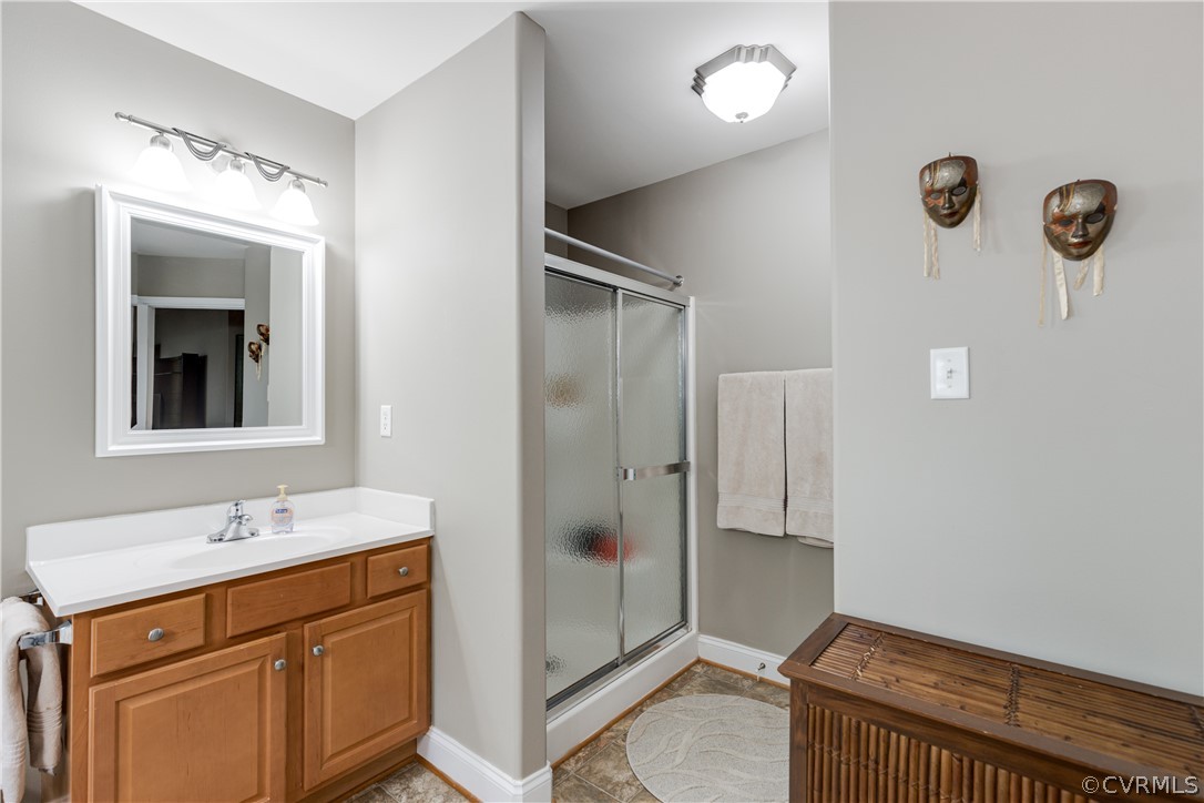 5924 Springmount Road Chesterfield, VA 23832 - Photo 29 of 49 a bathroom with a sink a mirror and a shower