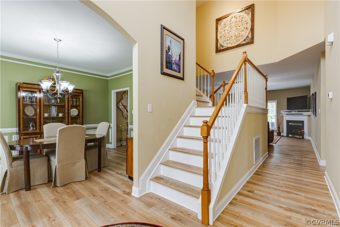 5924 Springmount Road Chesterfield, VA 23832 - Photo 3 of 49 a view of a hallway with wooden floor and staircase