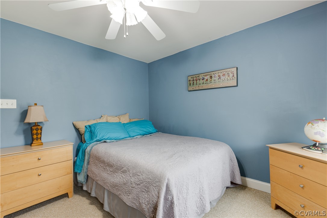 5924 Springmount Road Chesterfield, VA 23832 - Photo 36 of 49 a bedroom with a bed and a dresser in it