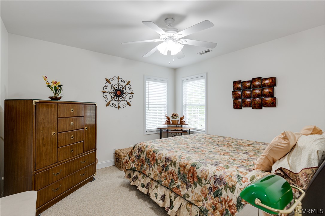 5924 Springmount Road Chesterfield, VA 23832 - Photo 37 of 49 a bedroom with a bed and a dresser