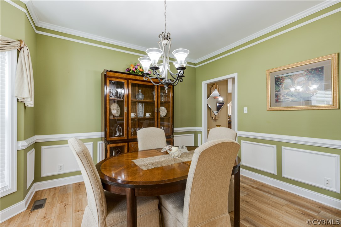 5924 Springmount Road Chesterfield, VA 23832 - Photo 5 of 49 a view of a dining room with furniture and chandelier
