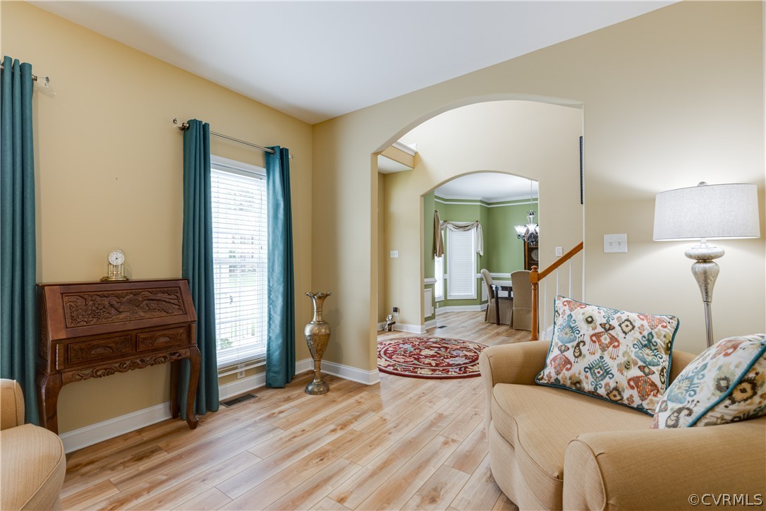 5924 Springmount Road Chesterfield, VA 23832 - Photo 9 of 49 a spacious bedroom with a bed and a chandelier