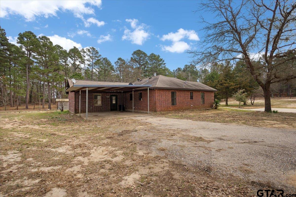 14733 County Road 384 Tyler, TX 75708 - Photo 21 of 38 a front view of a house with a garden