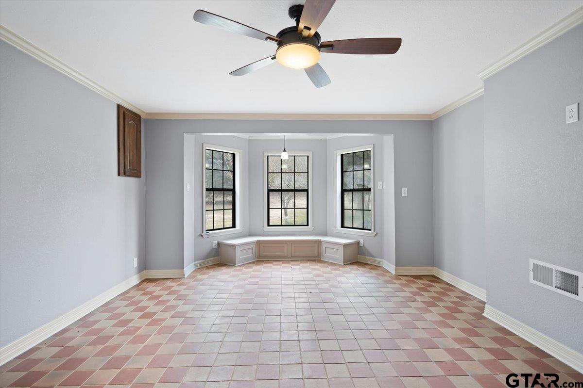 14733 County Road 384 Tyler, TX 75708 - Photo 3 of 38 a view of an empty room with window and chandelier fan