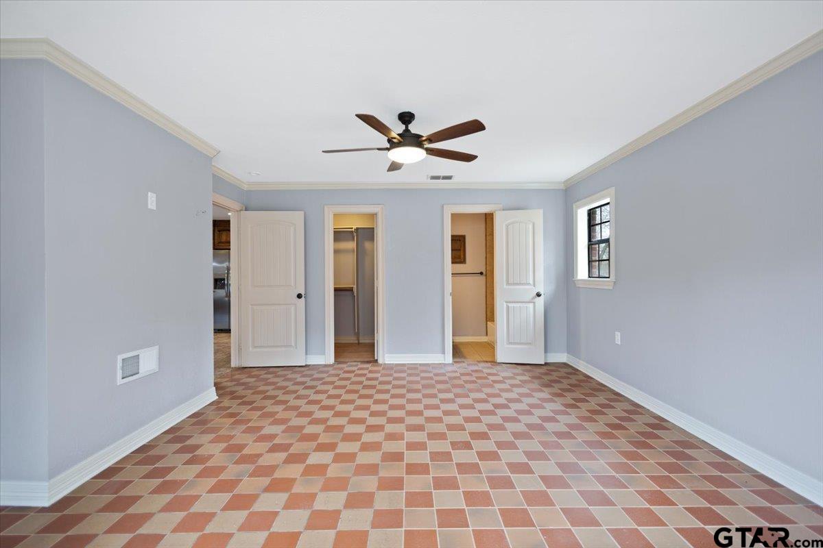14733 County Road 384 Tyler, TX 75708 - Photo 4 of 38 a view of a big room with wooden floor and a chandelier fan