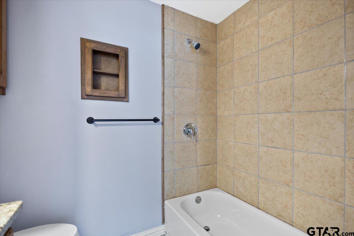 14733 County Road 384 Tyler, TX 75708 - Photo 7 of 38 a bathroom with a toilet and a shower