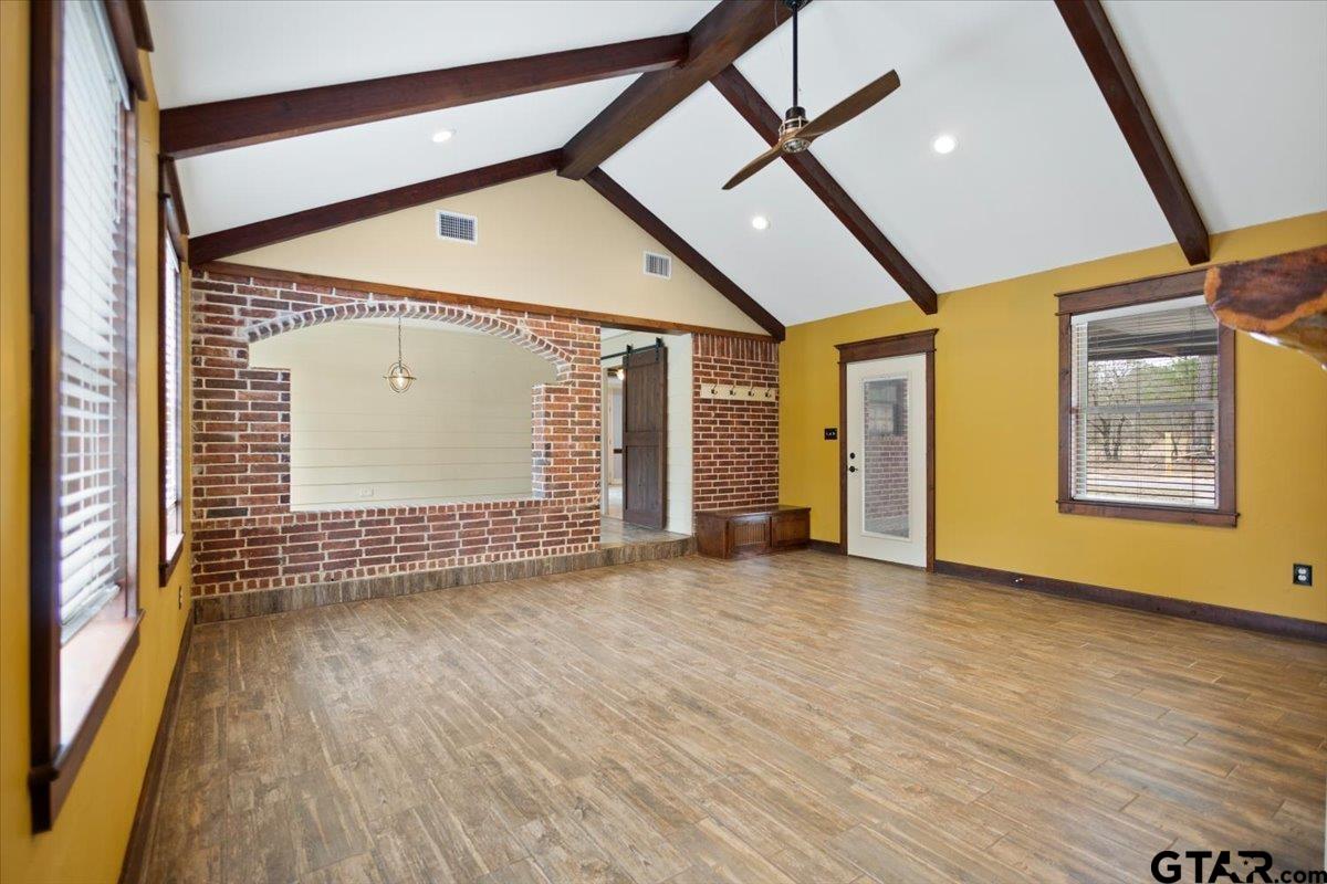 14733 County Road 384 Tyler, TX 75708 - Photo 10 of 38 an empty room with wooden floor and windows