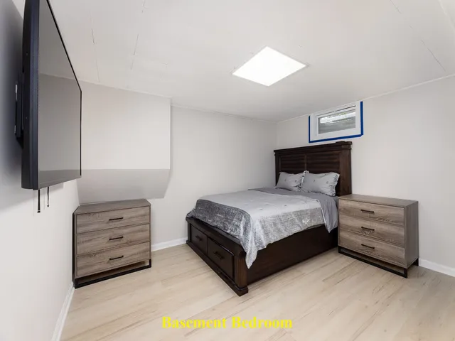 a bedroom with a bed and a television