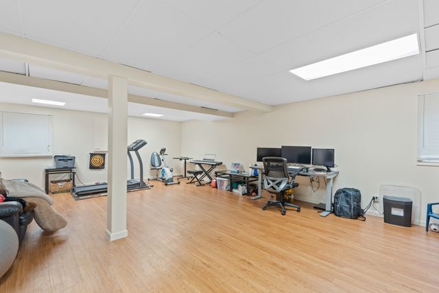 a view of a room with workspace and a window