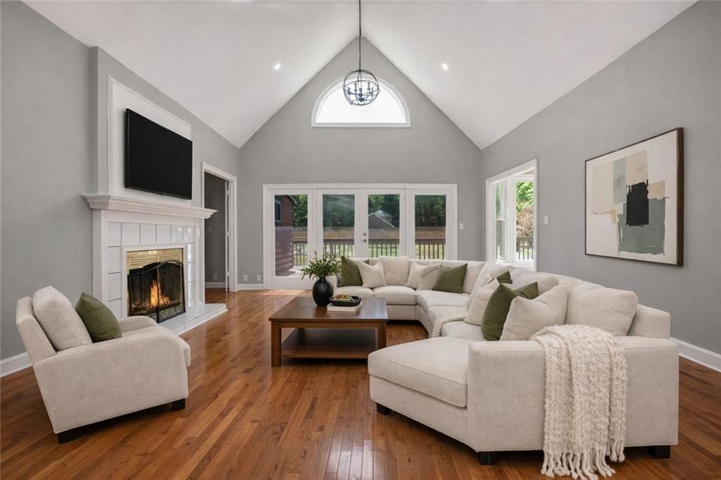 1206 Jasmine Road Dublin, GA 31021 - Photo 11 of 33 a living room with furniture a fireplace and a flat screen tv