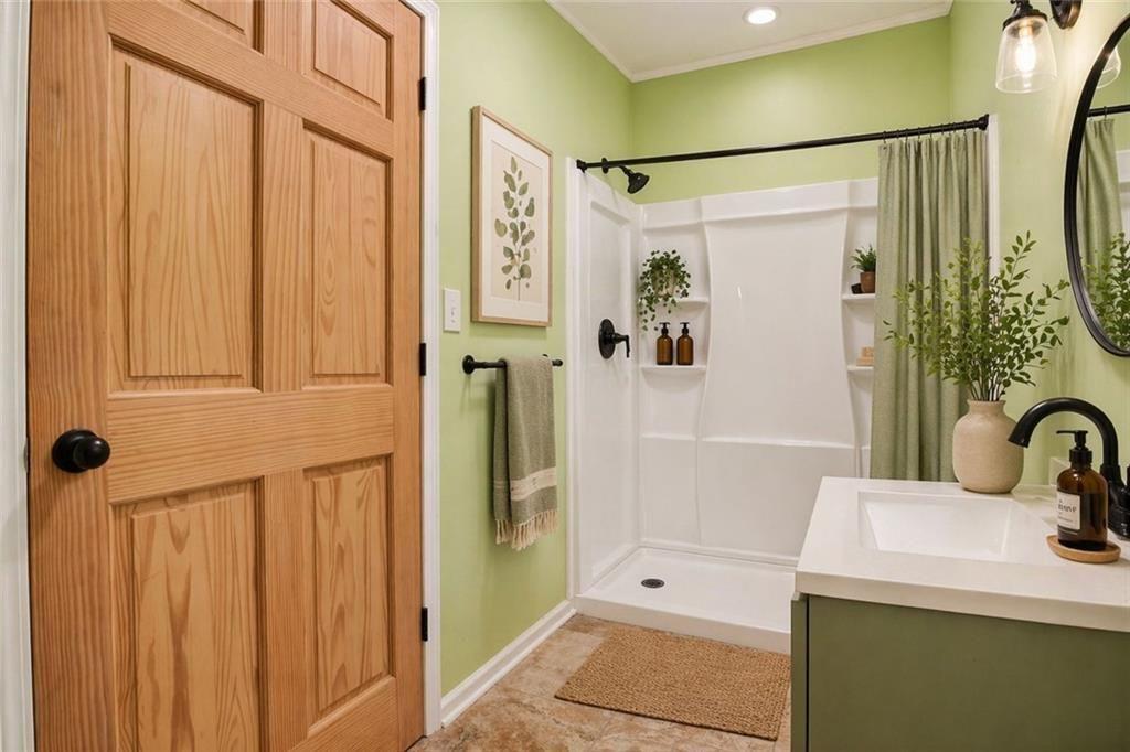 1206 Jasmine Road Dublin, GA 31021 - Photo 18 of 33 a bathroom with a shower and a sink