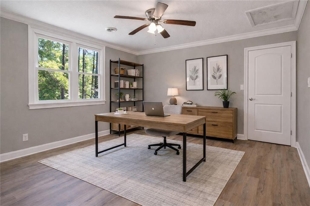 1206 Jasmine Road Dublin, GA 31021 - Photo 22 of 33 a view of a workspace with furniture and a window