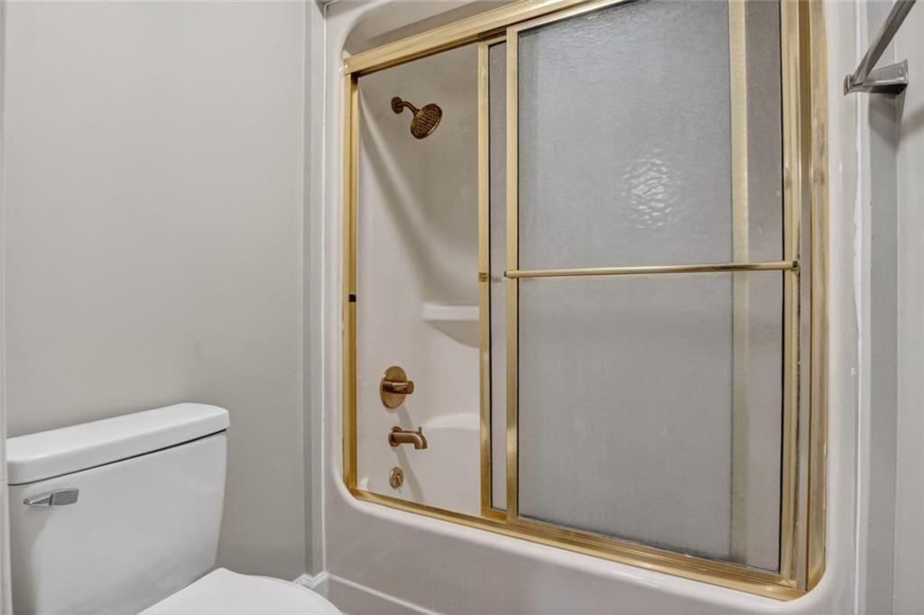 1206 Jasmine Road Dublin, GA 31021 - Photo 24 of 33 a bathroom with a shower and toilet