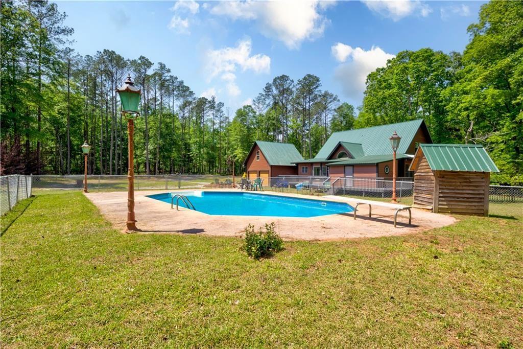 1206 Jasmine Road Dublin, GA 31021 - Photo 29 of 33 a view of a house with swimming pool and sitting area