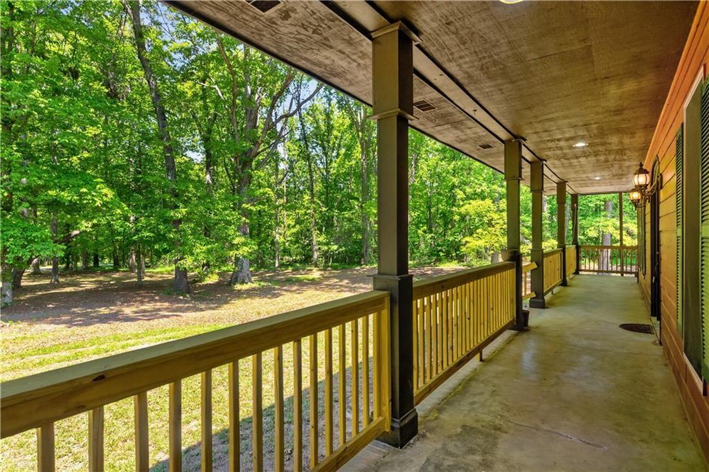 1206 Jasmine Road Dublin, GA 31021 - Photo 3 of 33 a view of a porch with wooden floor and outdoor space