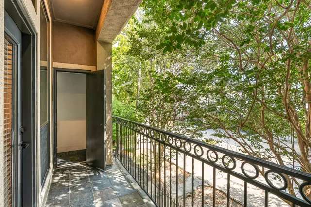 an empty room with windows and view of lake