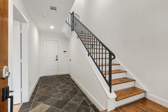 a view of a hallway with staircase