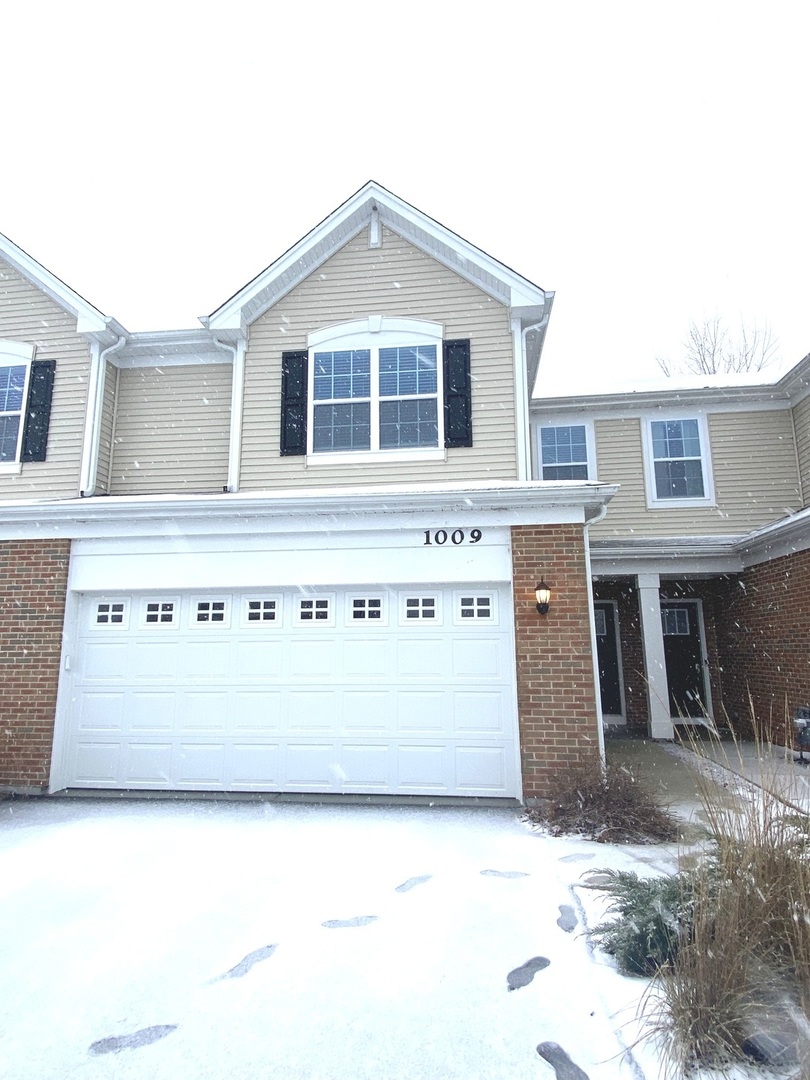 1009 North Draper Road McHenry, IL 60050 - Photo 1 of 20 a black and white house with outdoor space