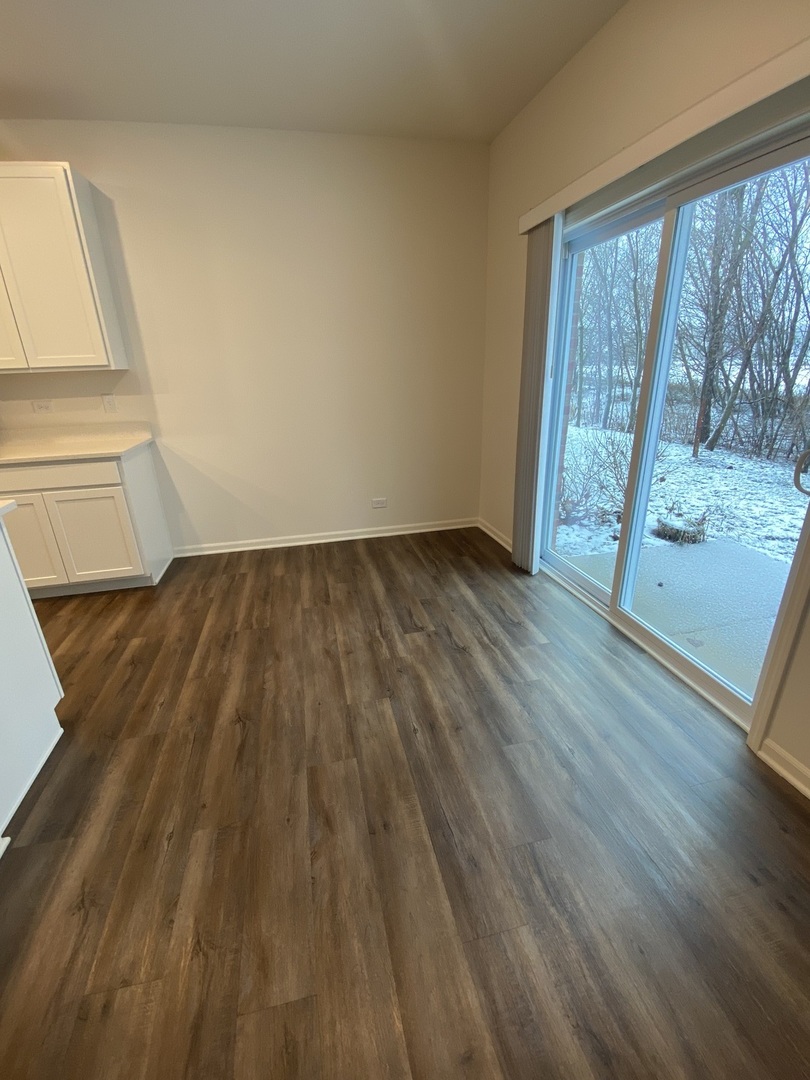 1009 North Draper Road McHenry, IL 60050 - Photo 5 of 20 a view of wooden floor and brick walls
