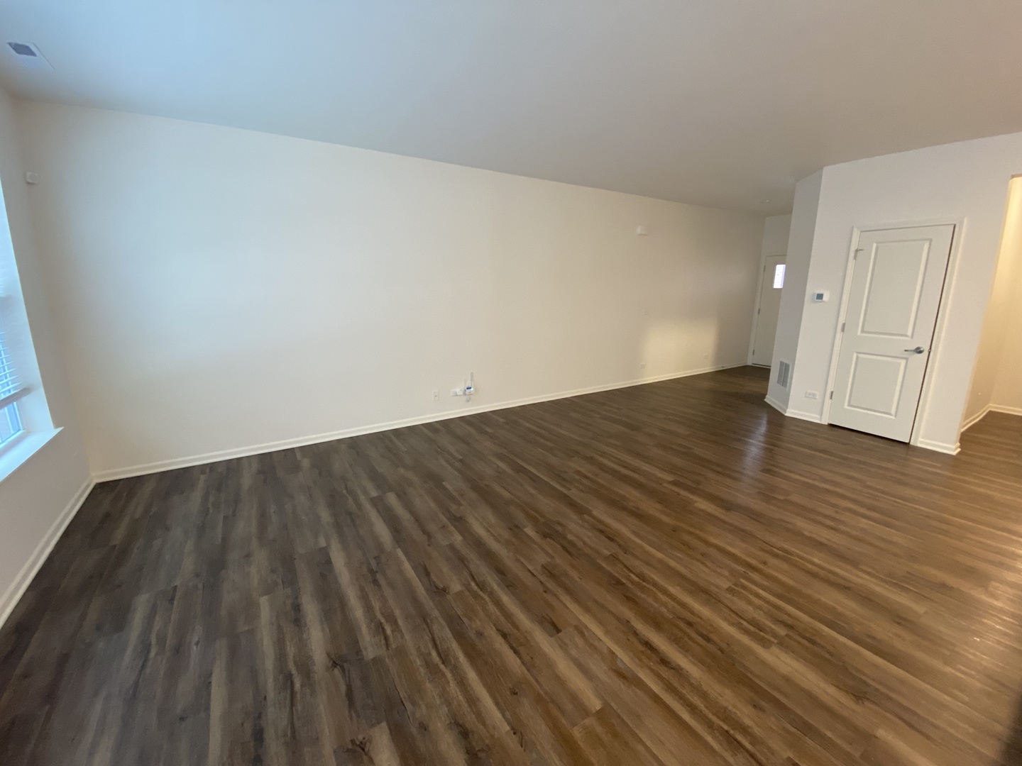 1009 North Draper Road McHenry, IL 60050 - Photo 7 of 20 a view of an empty room with wooden floor