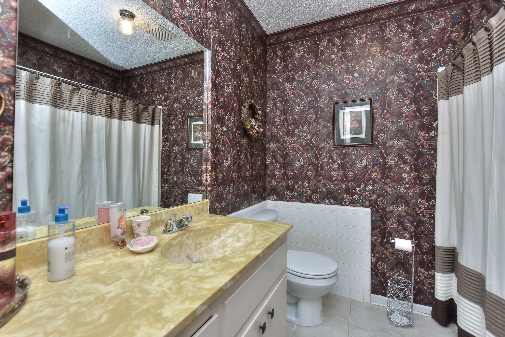 118 Oak Ridge Circle Georgetown, TX 78628 - Photo 29 of 38 a bathroom with a granite countertop sink and a mirror