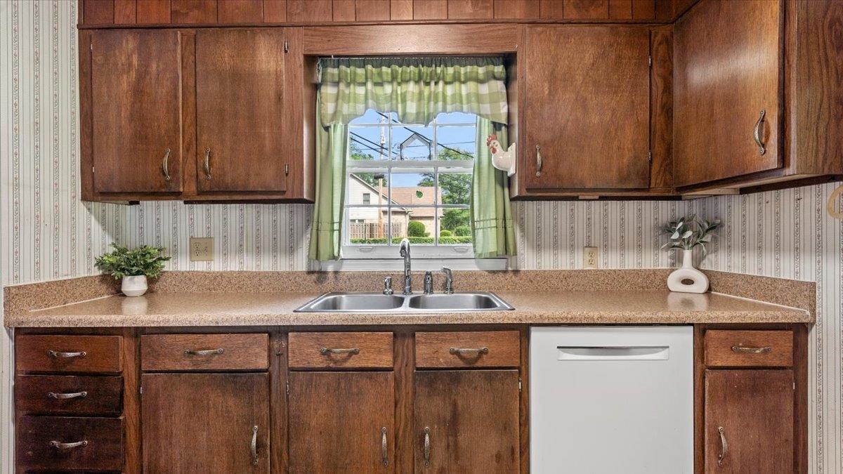 1601 Wynne Road Cordova, TN 38016 - Photo 13 of 31 a kitchen with a sink cabinets and a window