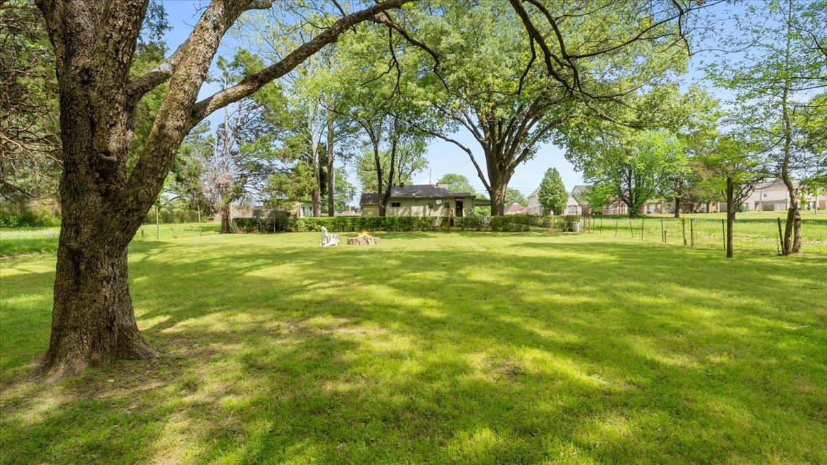 1601 Wynne Road Cordova, TN 38016 - Photo 23 of 31 a big yard with trees in the background
