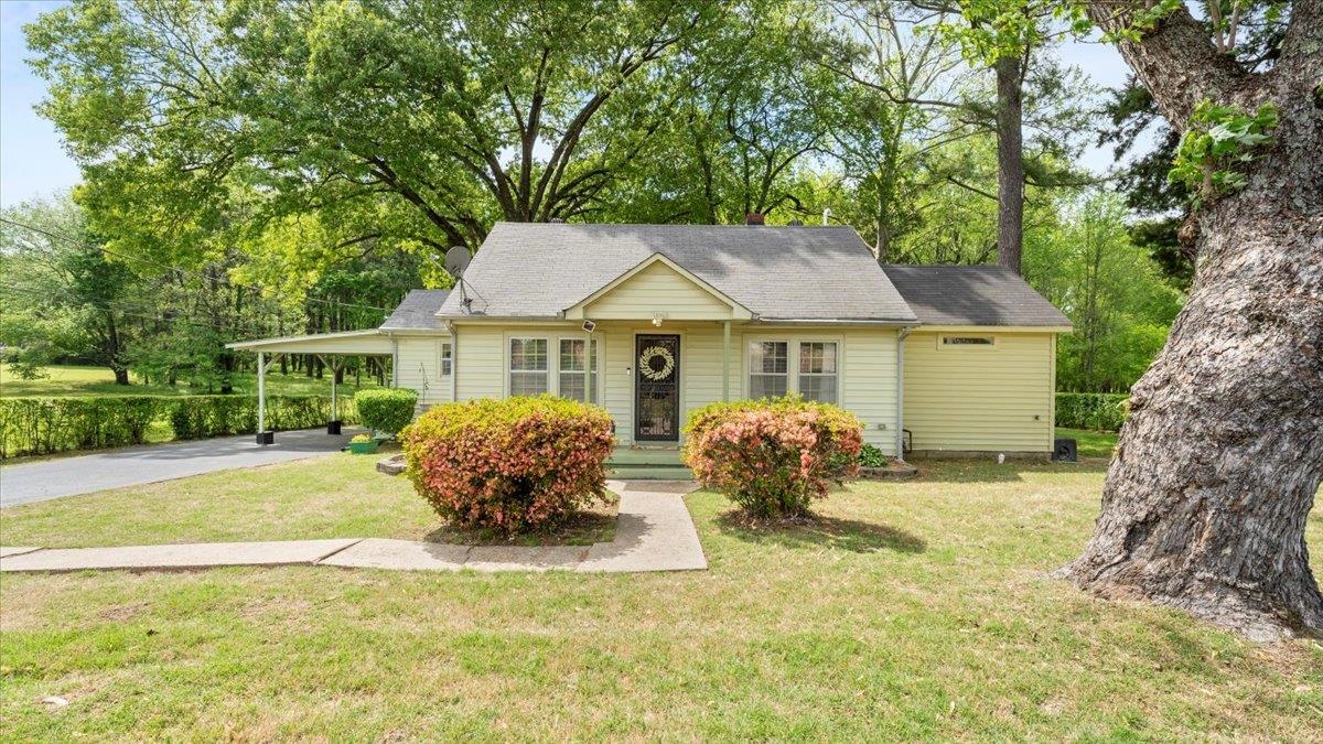 1601 Wynne Road Cordova, TN 38016 - Photo 3 of 31 a front view of house with yard and trees around